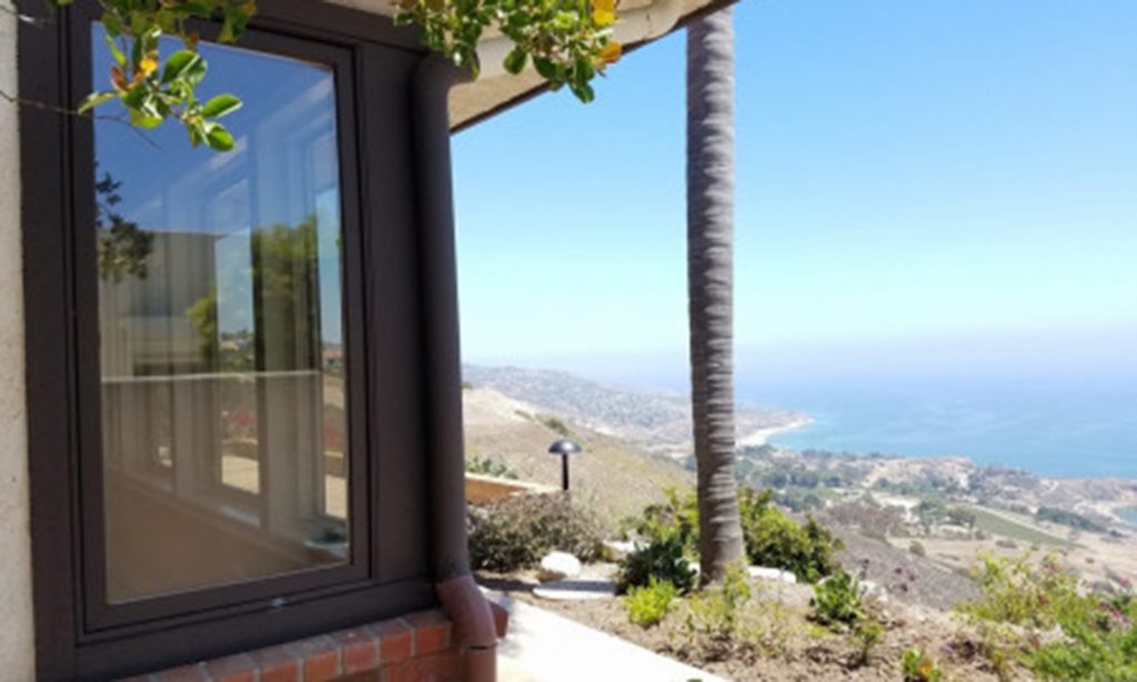 modern home with large windows and overlook
